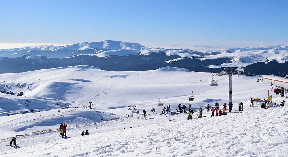 The chairlift and the Bucegi ridges, seen from the plateau
