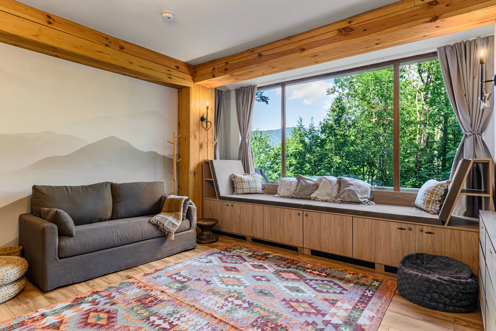 Living room with a sofa and panoramic window — Apartment 1