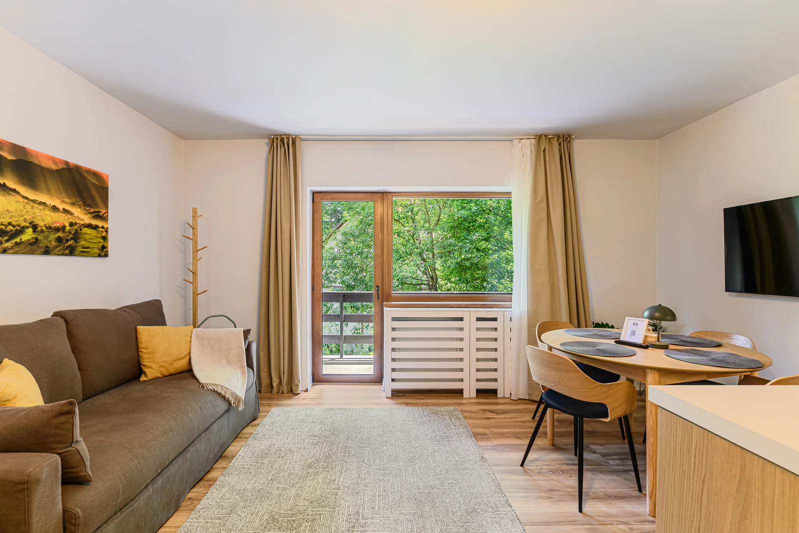 Living room and balcony access — Apartment 3